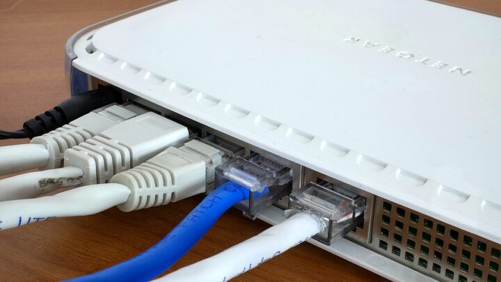 Ethernet cables connected to the rear ports of a home network router