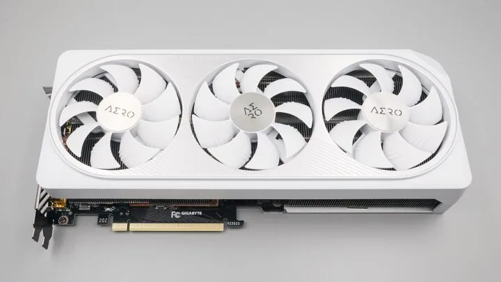 White triple-fan GeForce RTX 4070 graphics card showing its PCI Express connector