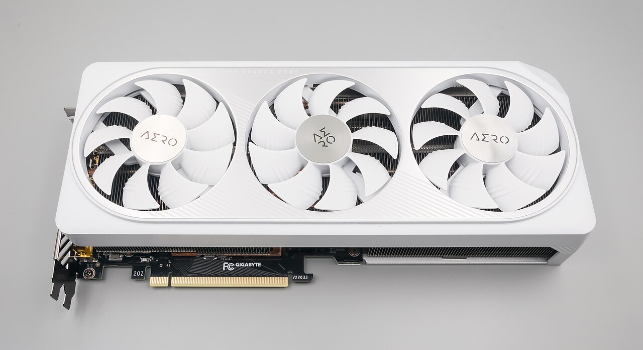 White triple-fan GeForce RTX 4070 graphics card showing its PCI Express connector