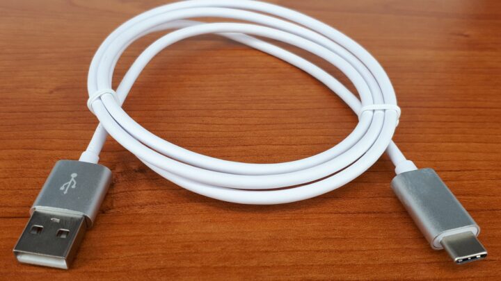 USB Type-C cable photographed on a wooden surface