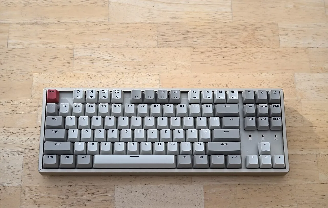 Keychron K8 mechanical keyboard photographed on a wooden tabletop