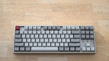 Keychron K8 mechanical keyboard photographed on a wooden tabletop